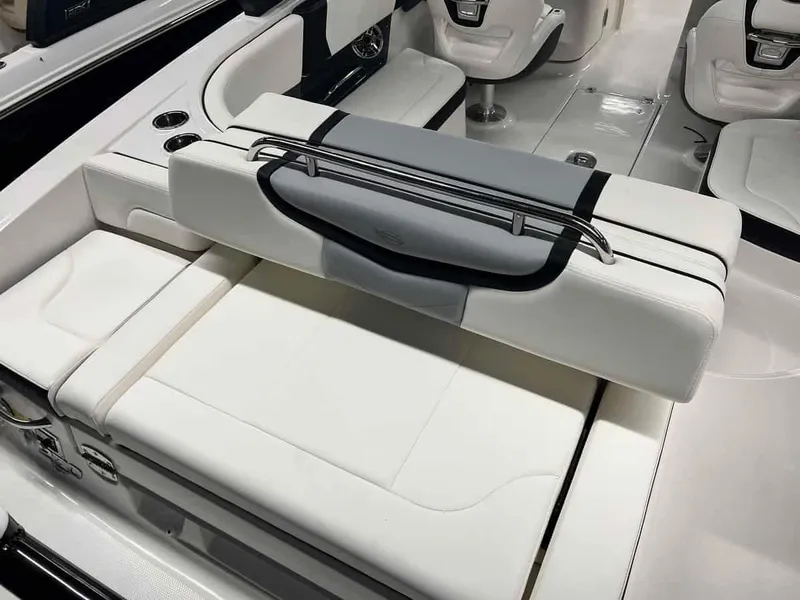 Slide: The Image of 2023 Chaparral 270 OSX boat interior with white seating and adjustable backrest. - 7