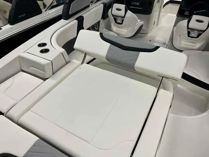 Slide: The Image of 2023 Chaparral 270 OSX boat interior with white seating and cup holders. - 8