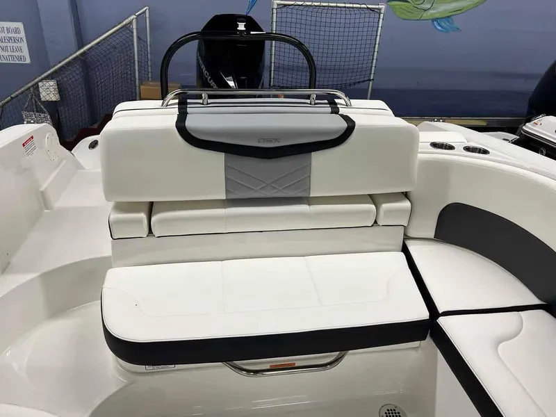 Slide: The Image of 2023 Chaparral 270 OSX boat interior with white and gray seating. - 9