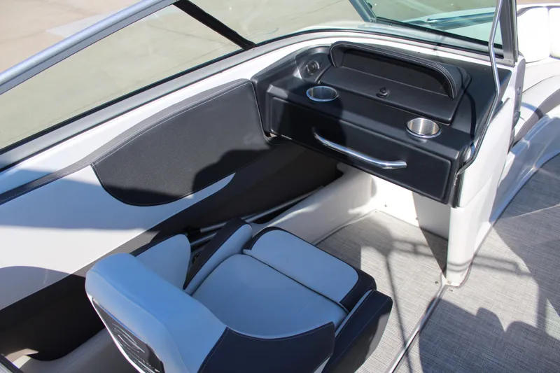 Slide: The Image of 2023 Crownline 220SS boat interior with modern seating and dashboard design. - 6