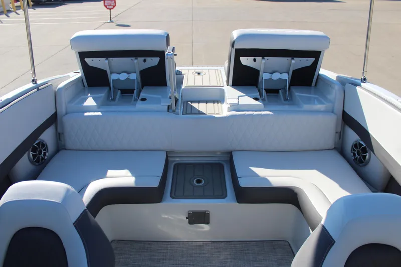 Slide: The Image of 2023 Crownline 220SS boat interior with plush seating and modern design. - 8