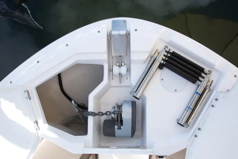Slide: The Image of 2023 Solara S-250 CW boat anchor compartment with chain and storage. - 10