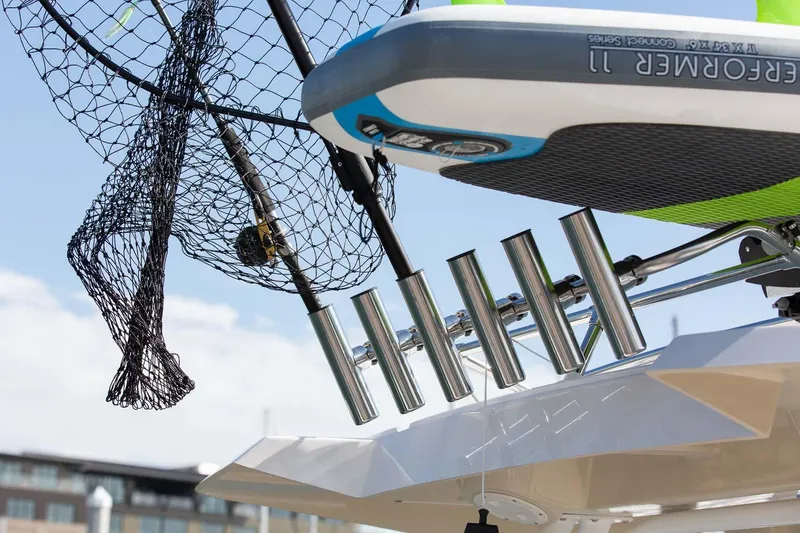Slide: The Image of Close-up of 2023 Solara S-250 CW boat with fishing rod holders and nets. - 11