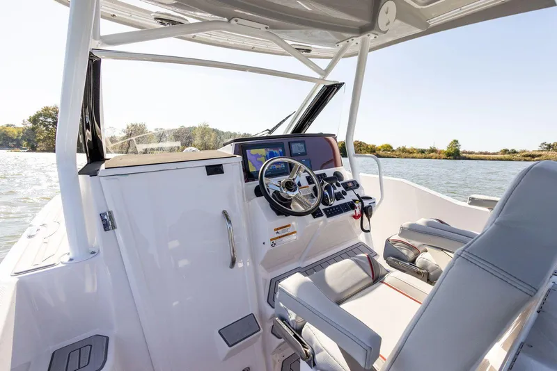 Slide: The Image of 2023 Solara S-250 CW boat cockpit with modern navigation system and comfortable seating. - 20