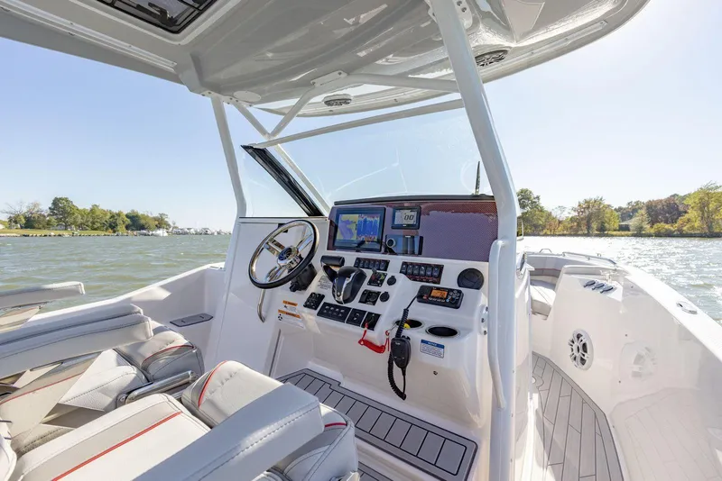 Slide: The Image of 2023 Solara S-250 CW boat cockpit with advanced navigation system and comfortable seating. - 21