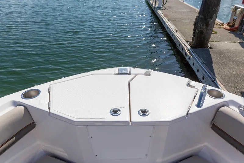 Slide: The Image of 2023 Solara S-250 CW boat bow at dock, featuring storage compartments. - 29