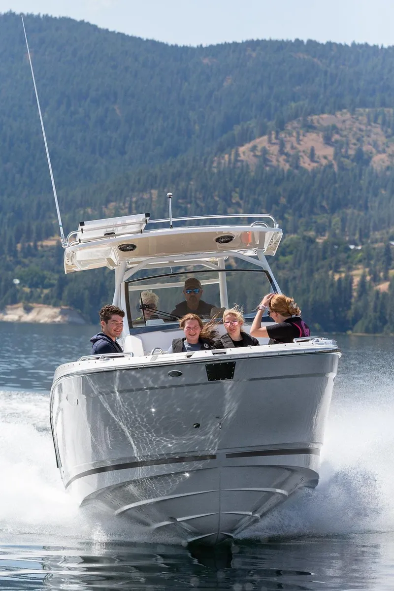 Slide: The Image of 2023 Solara S-250 CW boat cruising on a lake with passengers. - 3
