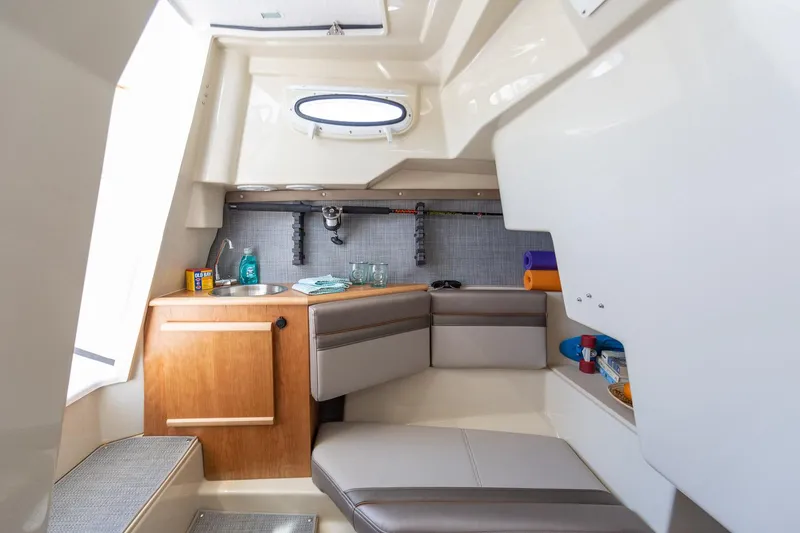 Slide: The Image of 2023 Solara S-250 CW boat interior with seating and kitchenette - 40