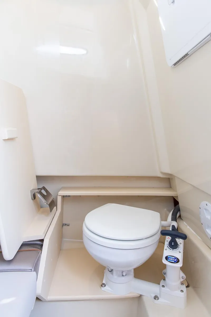 Slide: The Image of 2023 Solara S-250 CW boat bathroom with compact marine toilet. - 45