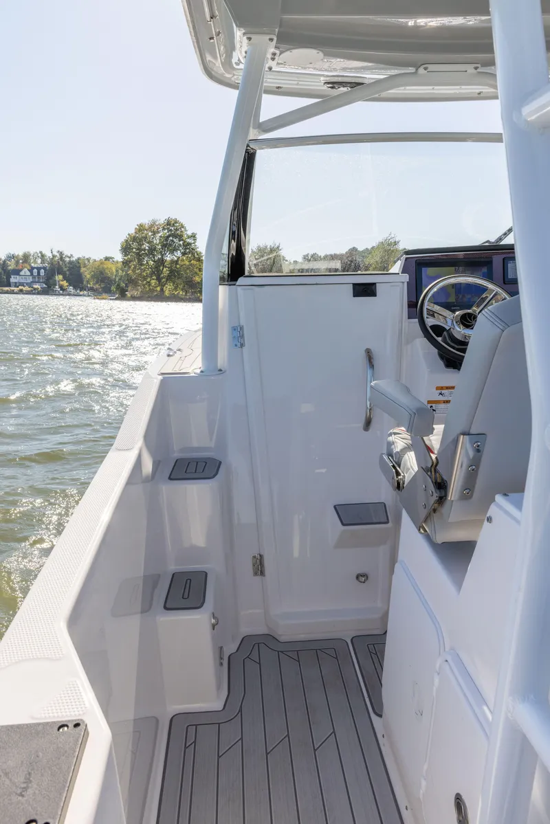 Slide: The Image of 2023 Solara S-250 CW boat interior with steering console and seating. - 48