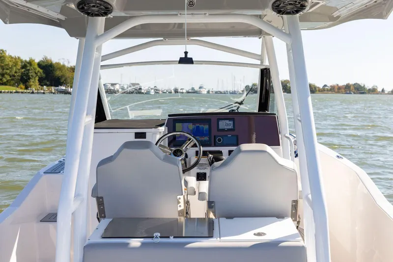 Slide: The Image of 2023 Solara S-250 CW boat cockpit with dual seats and advanced navigation system. - 49