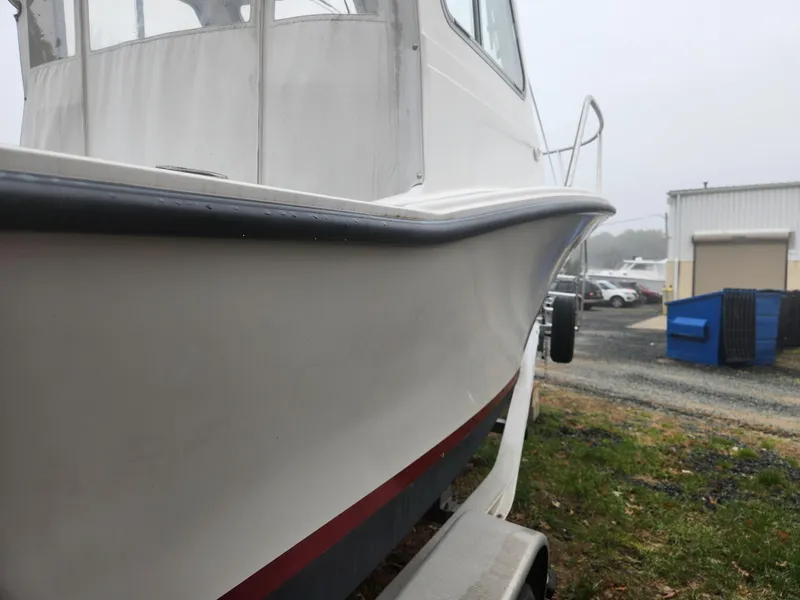 Slide: The Image of 2019 NorthCoast 215 HT boat on trailer, side view, overcast day. - 19