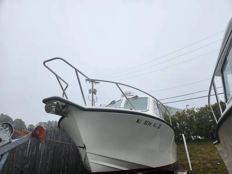 Slide: The Image of 2019 NorthCoast 215 HT boat on trailer, overcast sky background. - 21
