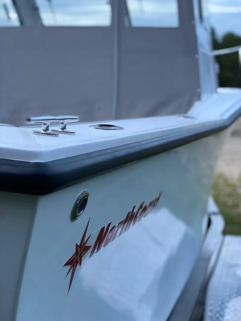 Slide: The Image of 2019 NorthCoast 215 HT boat, side view with logo and cleat. - 7