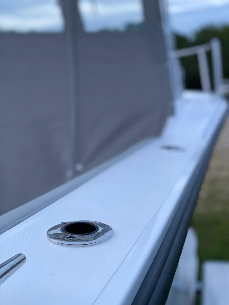 Slide: The Image of 2019 NorthCoast 215 HT boat detail, featuring sleek design and metal fittings. - 8