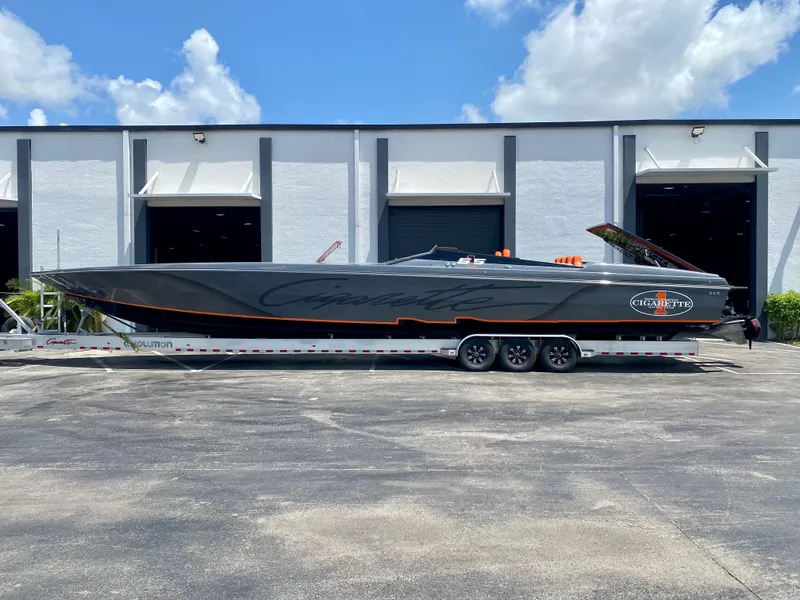 The Image of 2023 Cigarette 515 powerboat on a trailer outside a warehouse. - 0