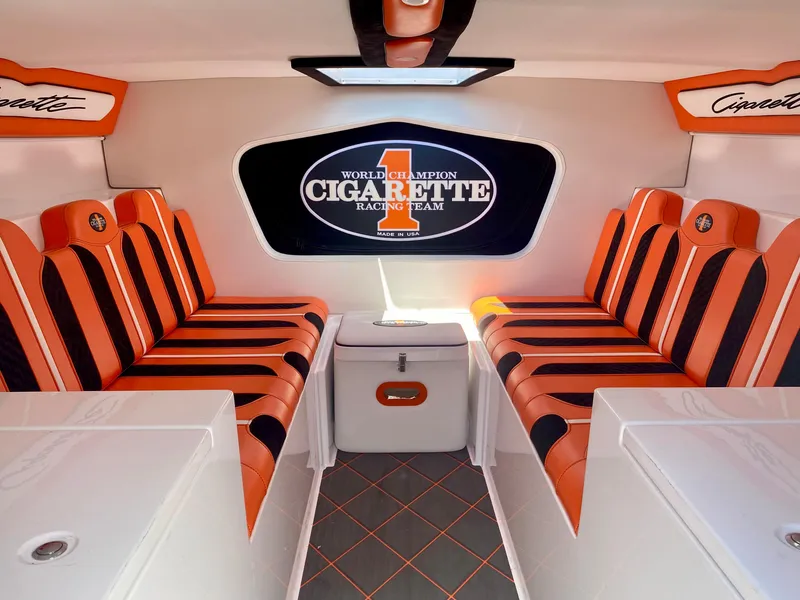 Slide: The Image of Interior of 2023 Cigarette 515 boat with orange and black seating. - 9