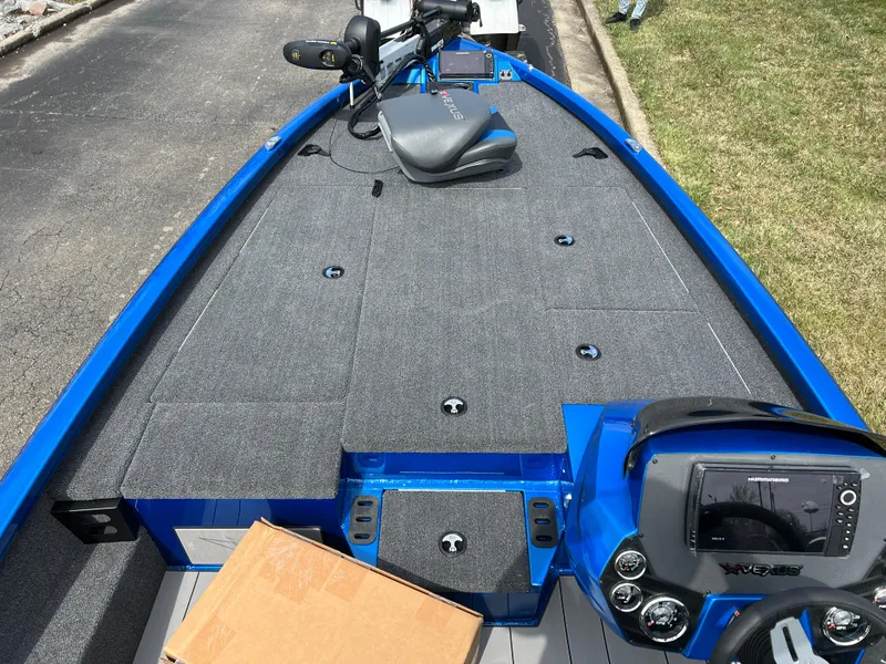 Slide: The Image of 2023 Vexus AVX1980 boat with blue trim and advanced navigation system. - 10