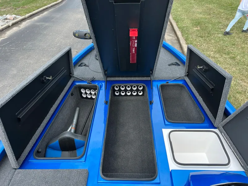 Slide: The Image of 2023 Vexus AVX1980 boat storage compartments and rod holders. - 11