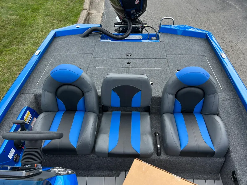 Slide: The Image of 2023 Vexus AVX1980 boat interior with blue and gray seating. - 15