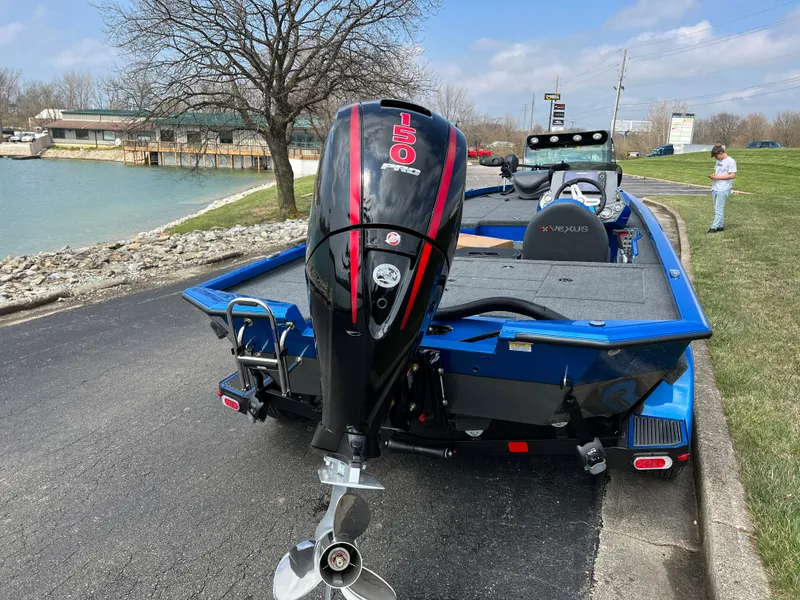 Slide: The Image of 2023 Vexus AVX1980 boat with a 150 HP Mercury outboard motor by a lakeside. - 4
