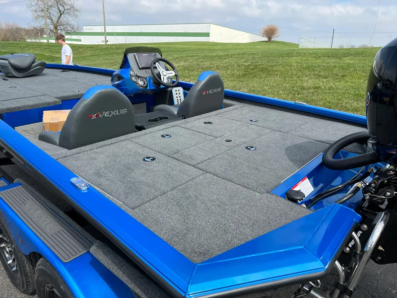 Slide: The Image of 2023 Vexus AVX1980 fishing boat with blue exterior and spacious deck. - 6