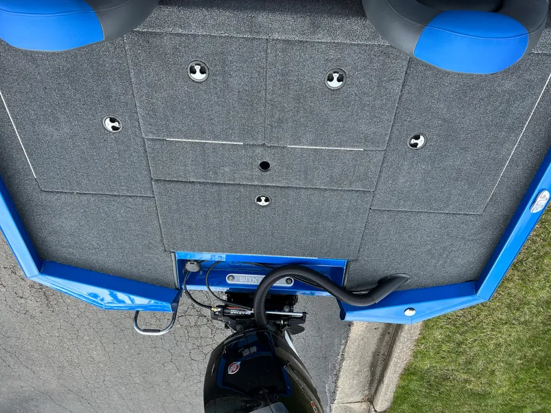 Slide: The Image of 2023 Vexus AVX1980 boat deck with blue trim and motor. - 7