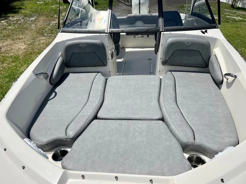 Slide: The Image of 2021 Stingray 191 DC boat with spacious seating and sunbathing area. - 13