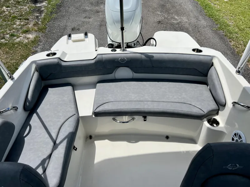 Slide: The Image of 2021 Stingray 191 DC boat interior with gray cushioned seating. - 19