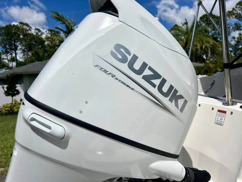Slide: The Image of 2021 Stingray 191 DC with Suzuki four-stroke outboard motor. - 24