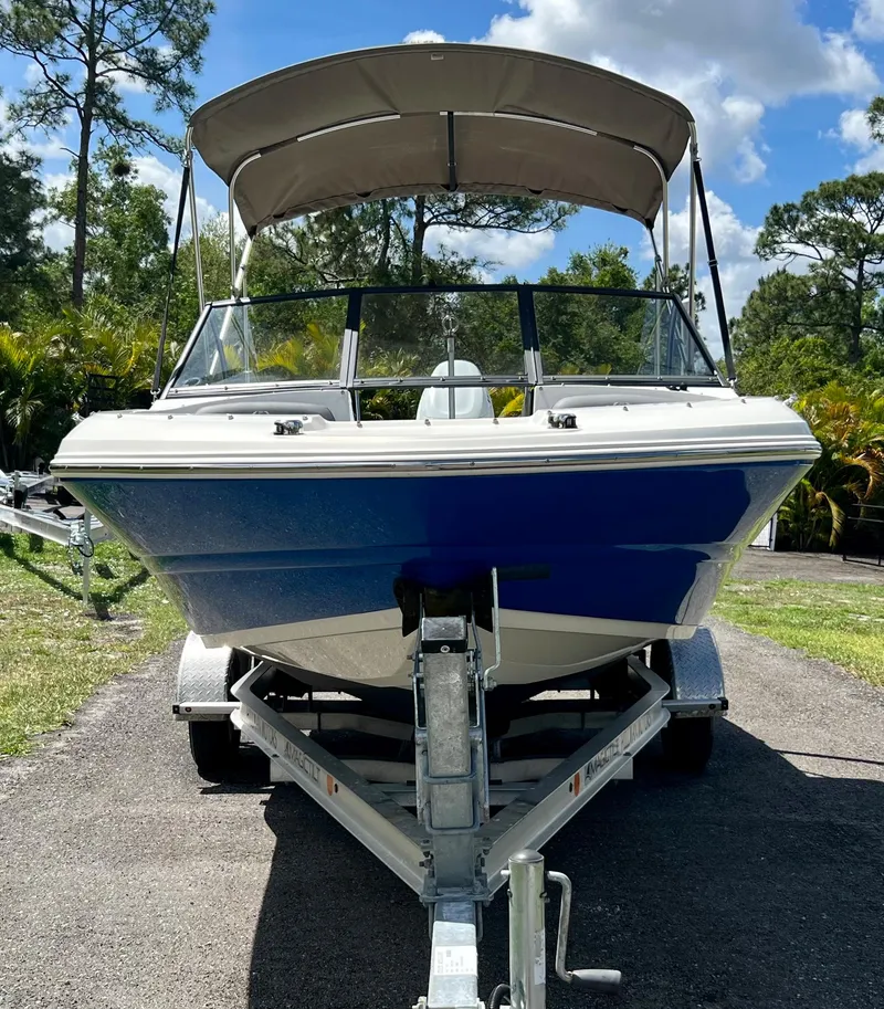 Slide: The Image of 2021 Stingray 191 DC boat on trailer with canopy. - 4