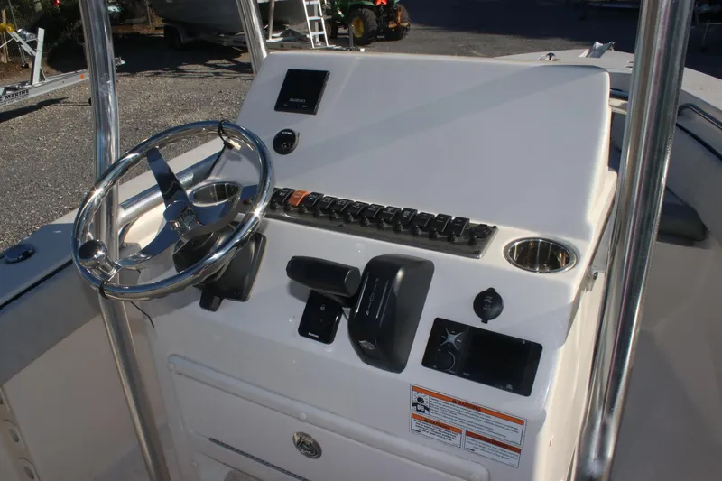 Slide: The Image of 2023 Sea Chaser 20 HFC boat console with steering wheel and controls. - 5