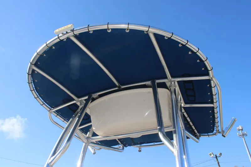 Slide: The Image of 2023 Sea Chaser 20 HFC boat canopy against clear blue sky. - 9