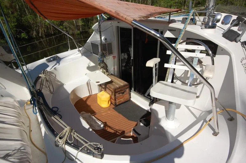 Slide: The Image of 1999 Wildcat 35 Catamaran cockpit with seating, storage, and canopy. - 18