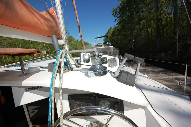 Slide: The Image of 1999 Wildcat 35 Catamaran cockpit with navigation equipment and steering wheel. - 23