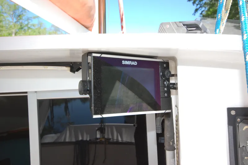 Slide: The Image of Simrad navigation system on a 1999 Wildcat 35 Catamaran. - 24