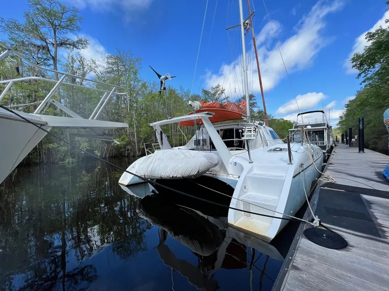 Slide: The Image of 1999 Wildcat 35 Catamaran docked on a sunny day. - 7