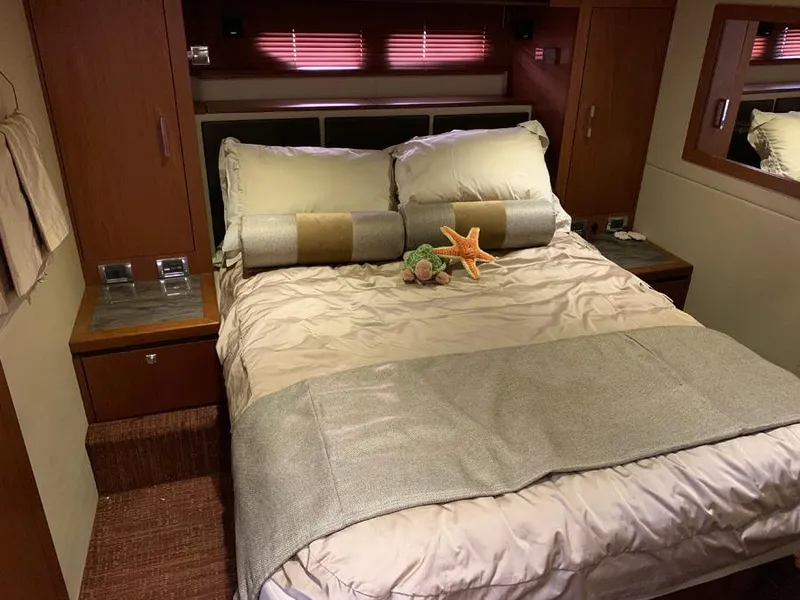 Slide: The Image of Luxurious bedroom interior of 2014 Sea Ray 510 Sundancer yacht with cozy bed and elegant decor. - 12