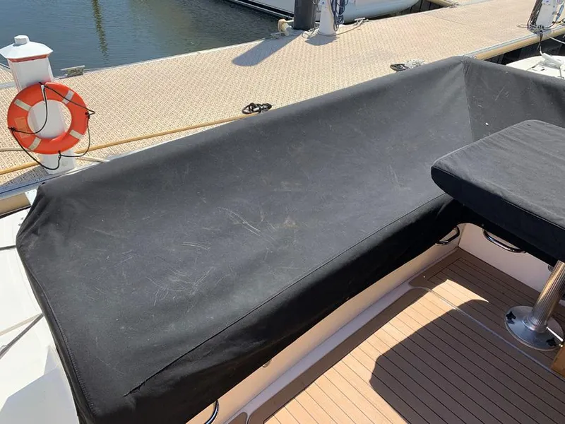 Slide: The Image of Covered seating area on a 2014 Sea Ray 510 Sundancer yacht at the dock. - 18