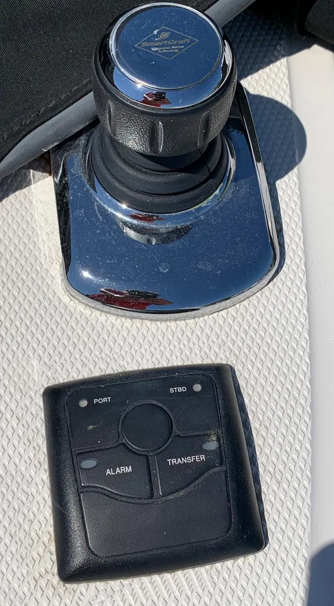 Slide: The Image of Joystick and control panel on a 2014 Sea Ray 510 Sundancer yacht. - 19