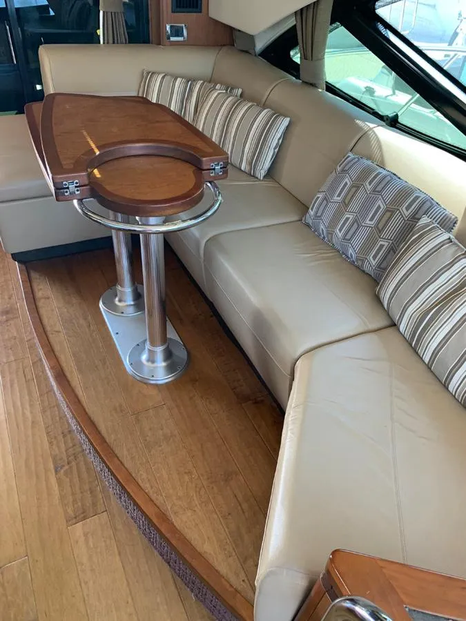 Slide: The Image of Luxurious interior seating area of a 2014 Sea Ray 510 Sundancer yacht. - 21