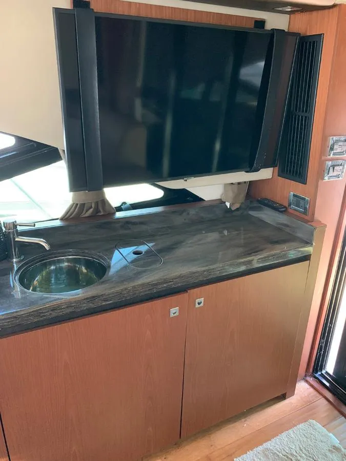 Slide: The Image of Interior of 2014 Sea Ray 510 Sundancer with TV and sink. - 22