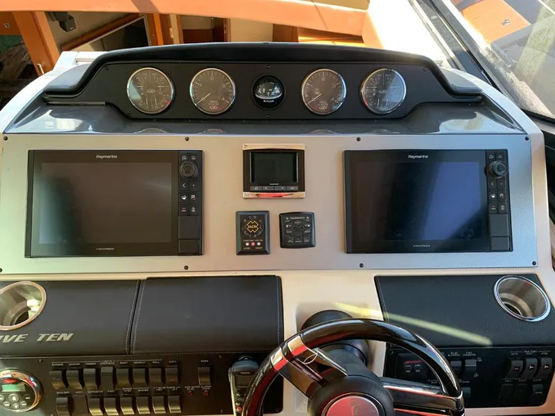Slide: The Image of 2014 Sea Ray 510 Sundancer helm with dual Raymarine displays and gauges. - 3