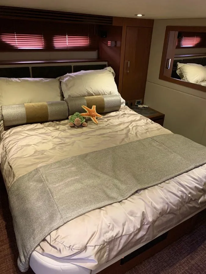 Slide: The Image of Luxurious bedroom in 2014 Sea Ray 510 Sundancer yacht with plush bedding. - 32