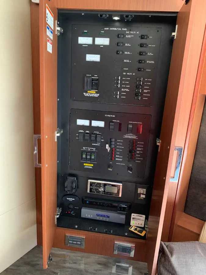 Slide: The Image of Electrical control panel inside a 2014 Sea Ray 510 Sundancer yacht. - 35