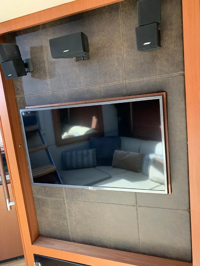 Slide: The Image of Entertainment system in 2014 Sea Ray 510 Sundancer yacht with TV and speakers. - 36