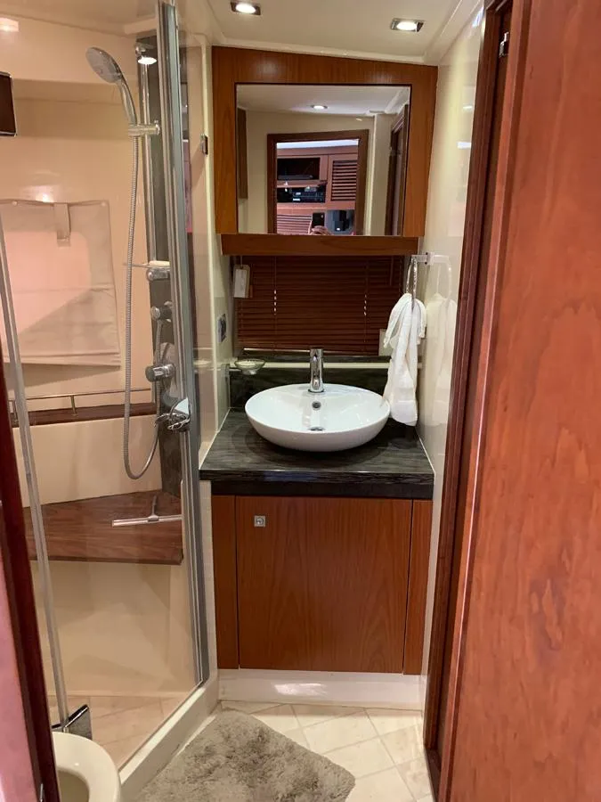 Slide: The Image of Modern bathroom in 2014 Sea Ray 510 Sundancer yacht with vessel sink and shower. - 37