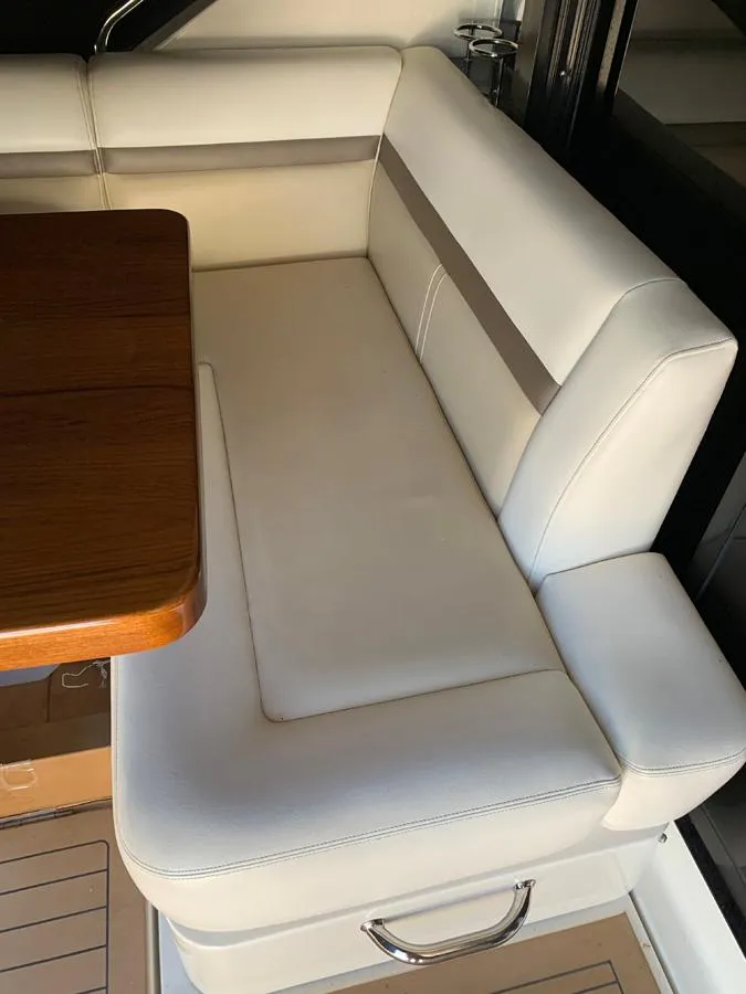 Slide: The Image of White leather seating area on 2014 Sea Ray 510 Sundancer yacht. - 42