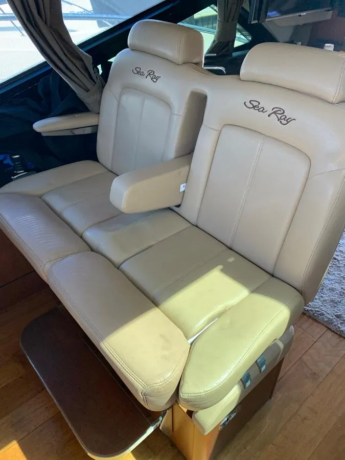 Slide: The Image of 2014 Sea Ray 510 Sundancer beige leather captain's chairs. - 8