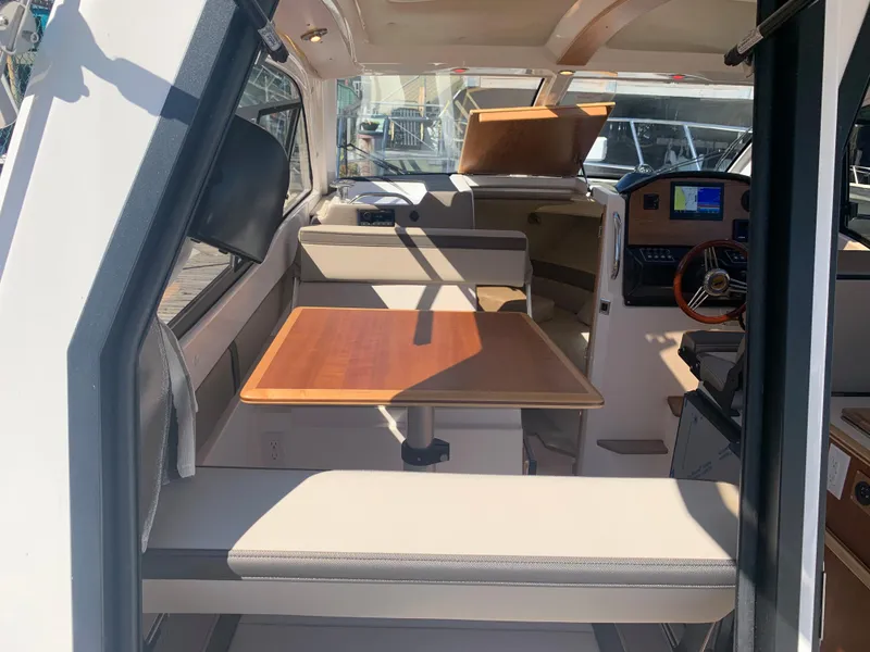 Slide: The Image of Interior of 2022 Cutwater C-24 Coupe, featuring seating and navigation area. - 15